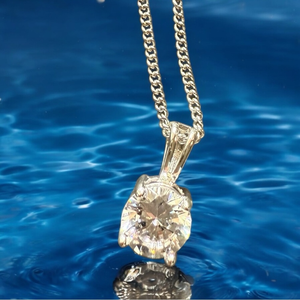 Cubic Zirconia pendant on silver chain.